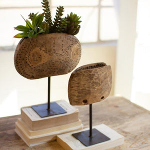 Repurposed Wooden Cow Bell Planters on Iron Stands