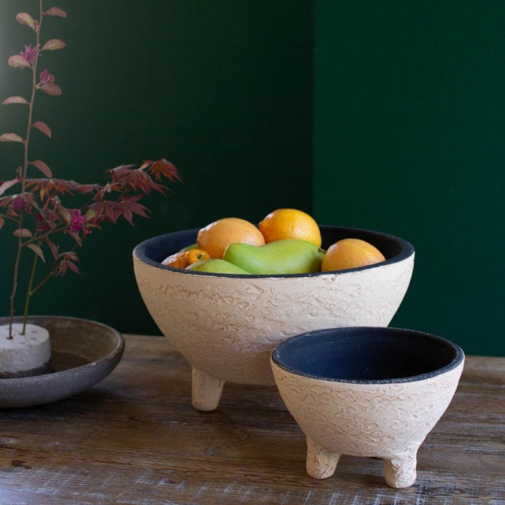 https://rustic.com/cdn/shop/products/Ivory-and-Black-Textured-Footed-Clay-Bowls_1200x.jpg?v=1655322924